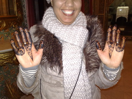 A picture of a woman's hands, decorated with henna for a wedding.
